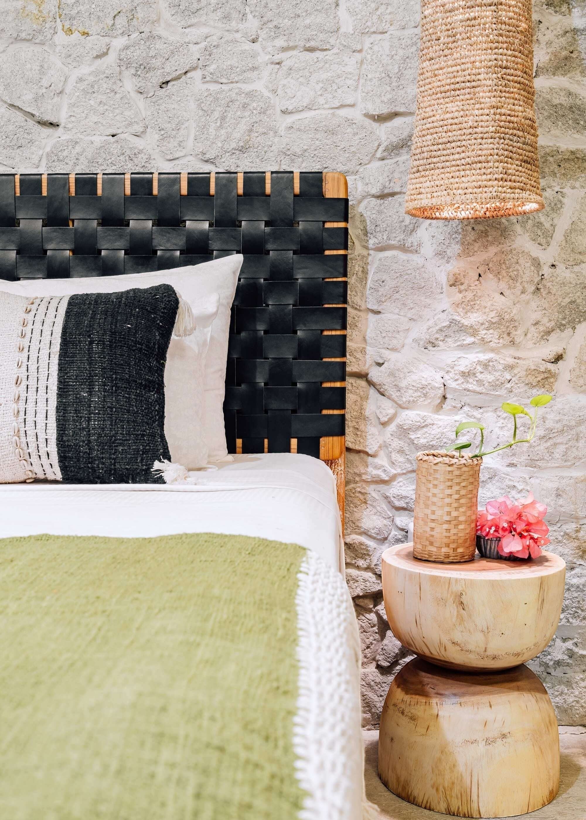 Kayu Living Umalas headboard with black woven leather straps and teak frame. Modern artisanal design.