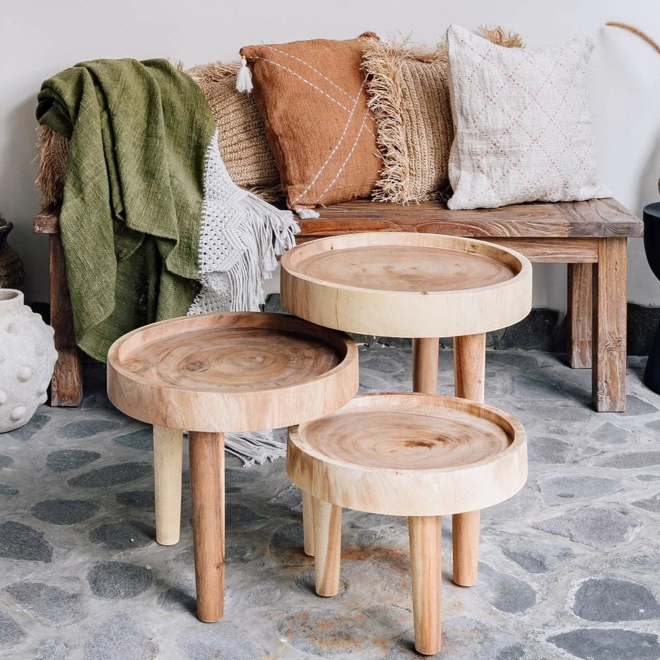 Kayu Living Ulu side tables crafted from natural suar wood with distinctive grain patterns. Set of three, varying sizes, perfect for boho or minimalist decor.