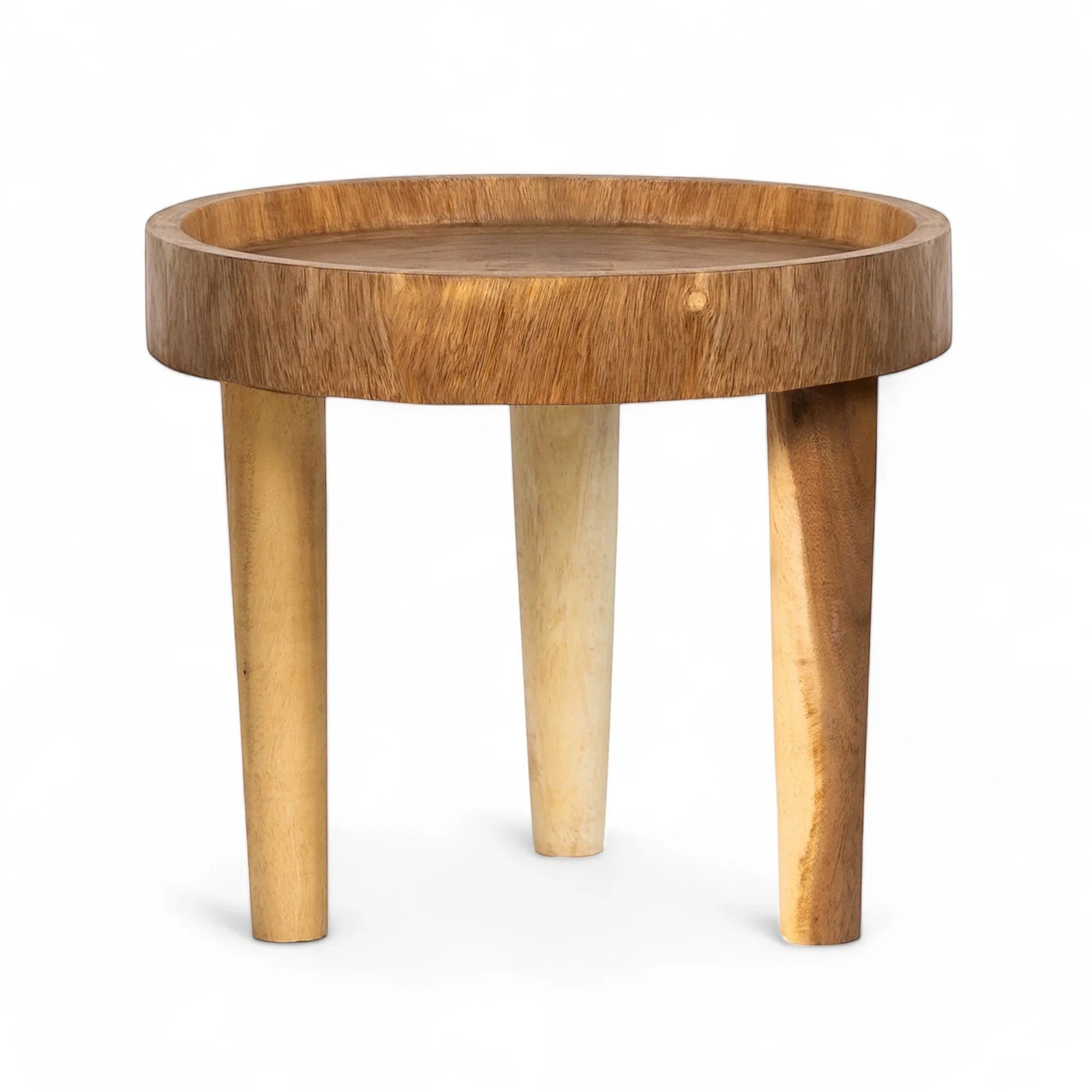 Kayu Living Ulu side table made of suar wood with a round top and three tapered legs in natural wood tones.