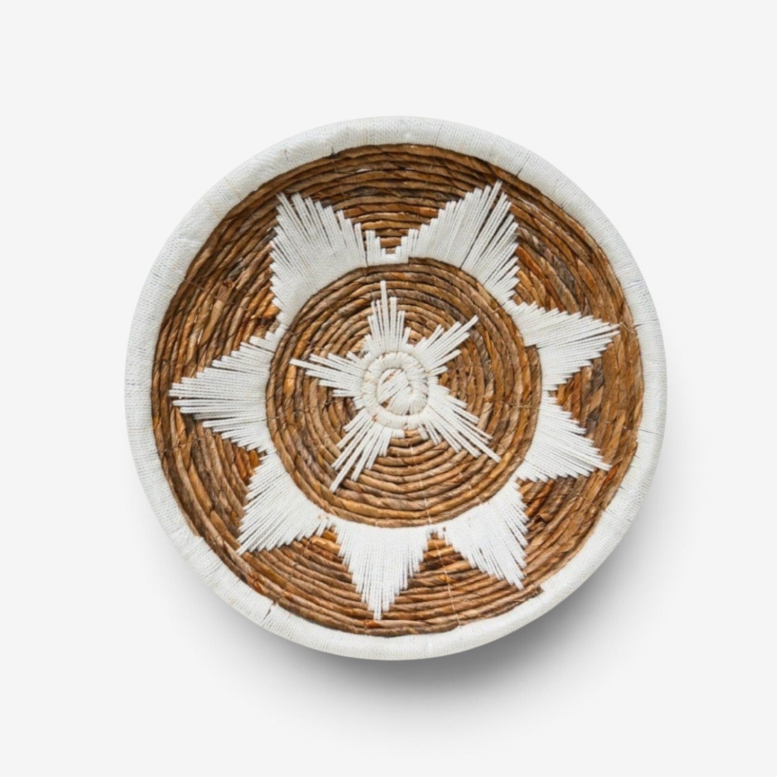 Kayu Living Uluwatu medium wall basket in brown and white banana leaf and cotton with a star pattern