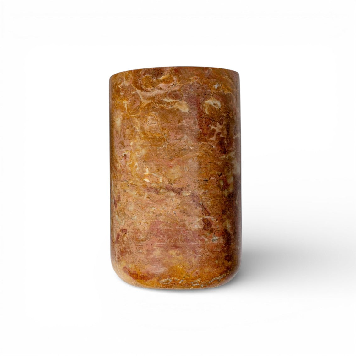 Brown cylindrical stone object on a white background