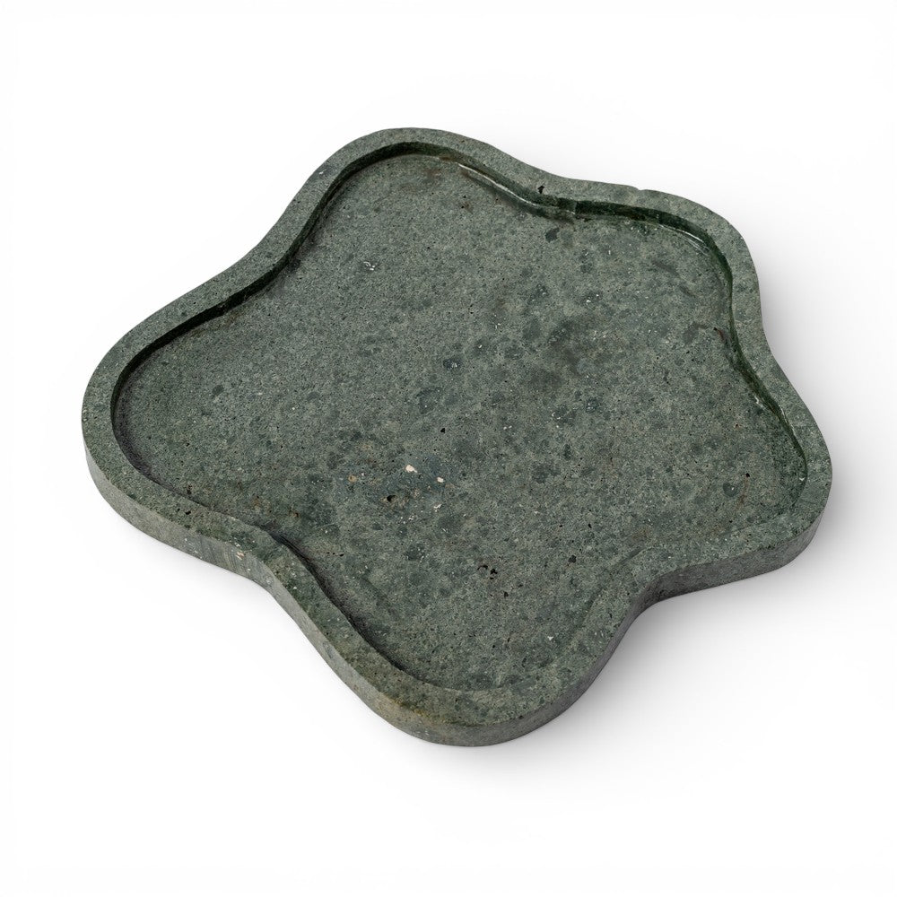 Decorative stone with a scalloped edge on a white background