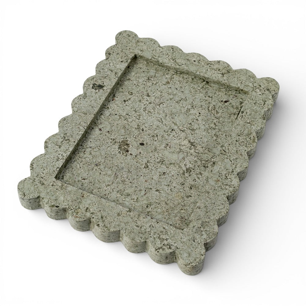 Stone tray with decorative edge on a white background