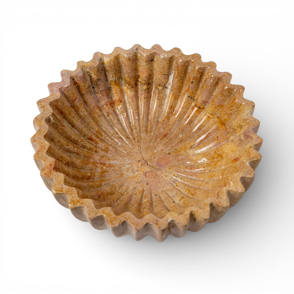 Brown ceramic bowl with textured surface on a white background