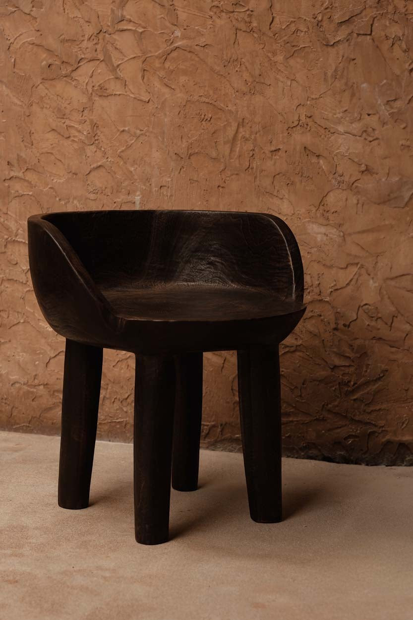 Dark walnut Bazar Bizar Antwerp The Sit Happens Low Chair with sleek wooden frame and cushioned seat.