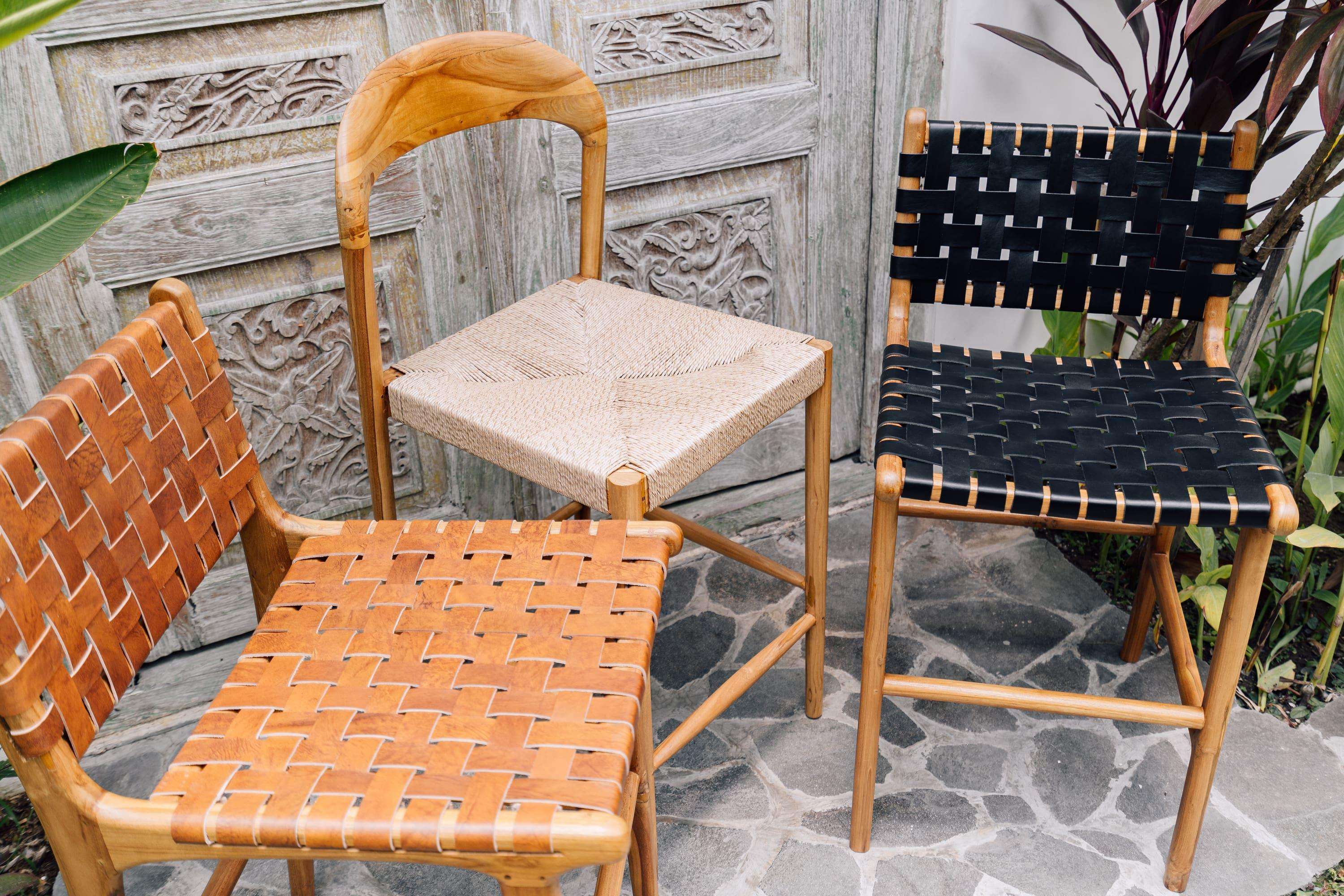 Three handcrafted woven chairs in natural wood, displayed outdoors by Kayu Living