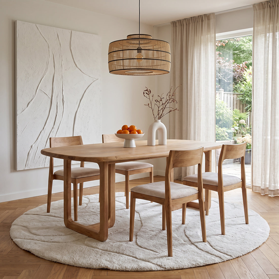 Set of two Raw Materials Freya teak dining chairs in cream with sleek, modern design and smooth wooden finish.