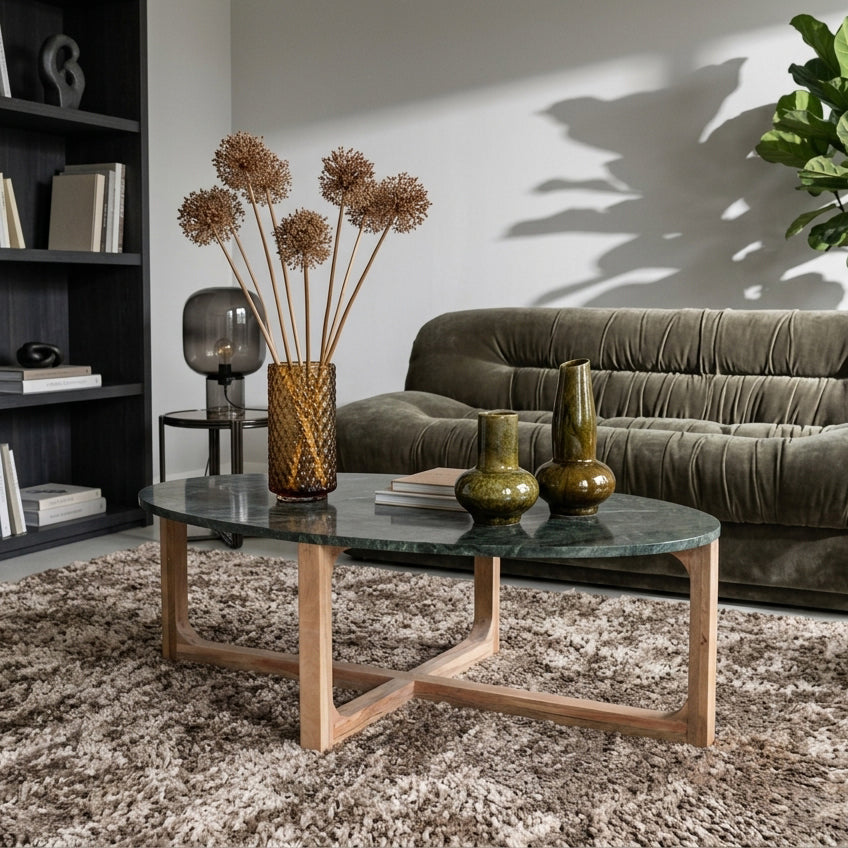 Green marble coffee table by Raw Materials, showcasing a sleek, modern design with smooth surface and sturdy legs.