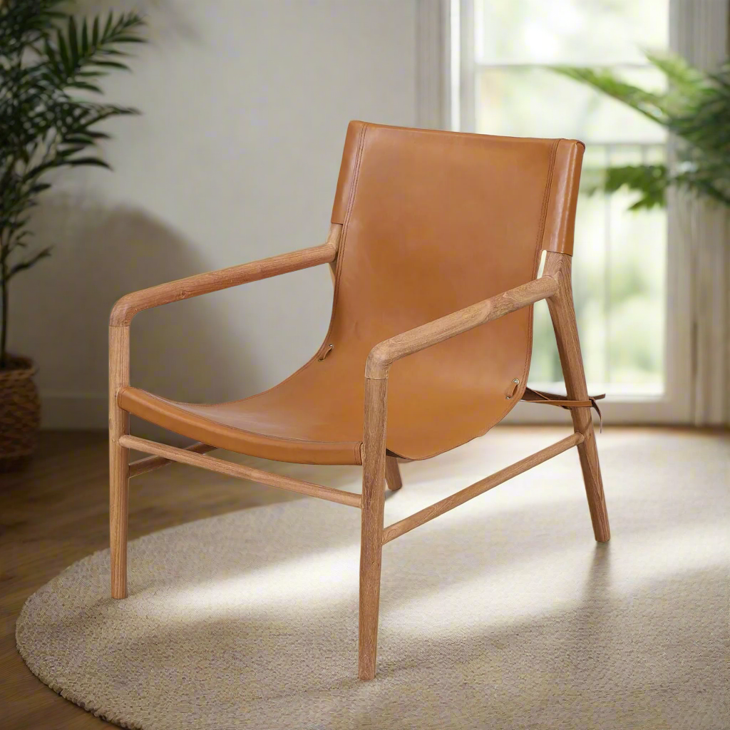 Brown leather chair with wooden frame on a white background