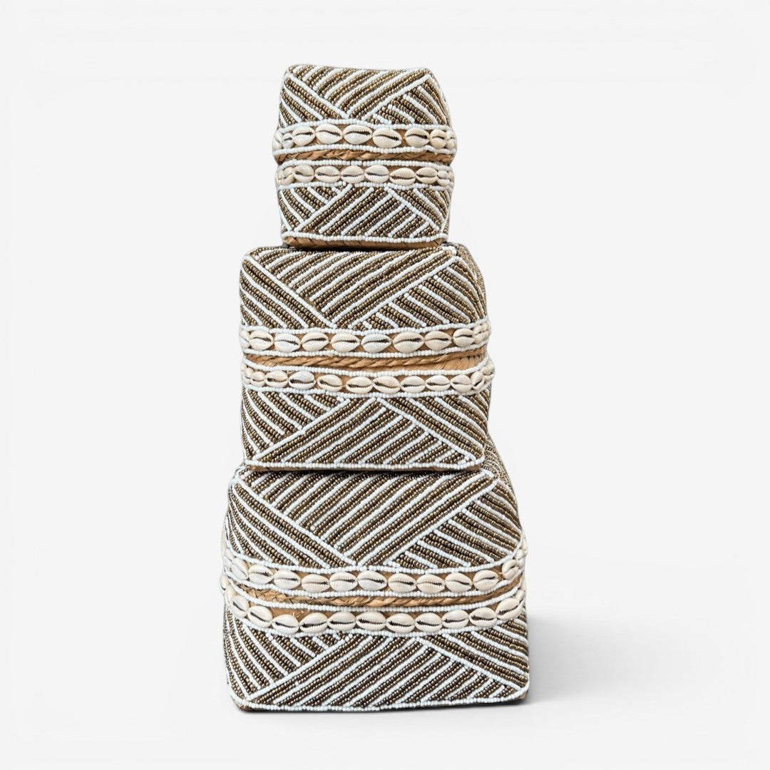Kayu Living handmade beaded boxes in gold, white, and natural shells. Geometric pattern with rope detail.