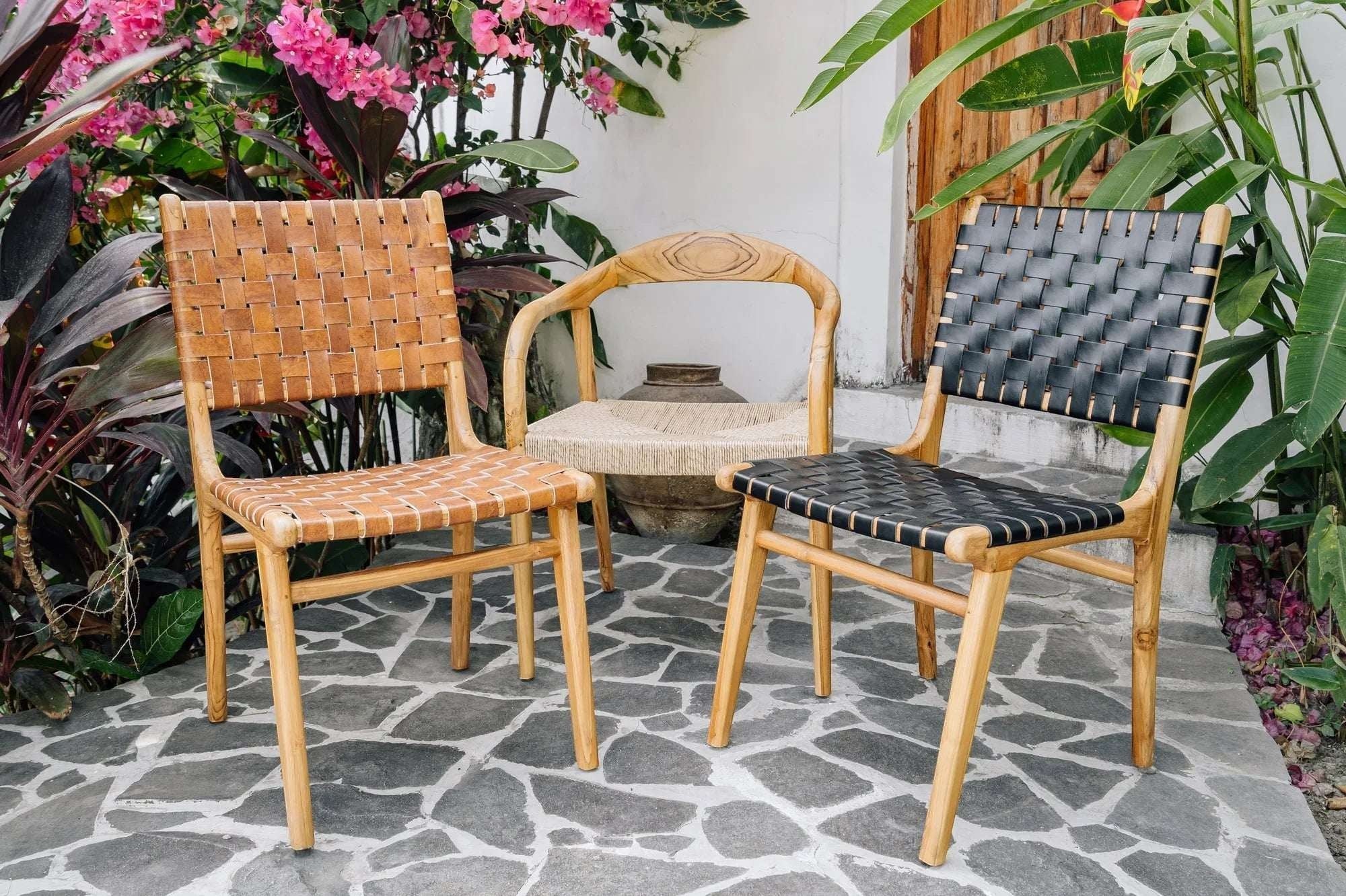 Kayu Living Umalas dining chair with hand-woven black leather seat and teak frame. Modern design, traditional craftsmanship.
