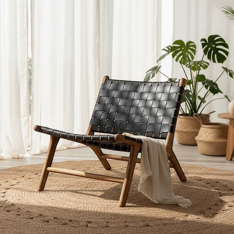 Kayu Living Umalas lounge chair with black handwoven leather seat and teak frame.