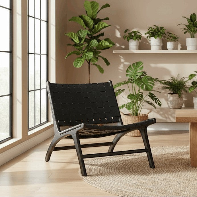 Kayu Living black handwoven leather lounge chair with black teak frame, modern design for living room or office.