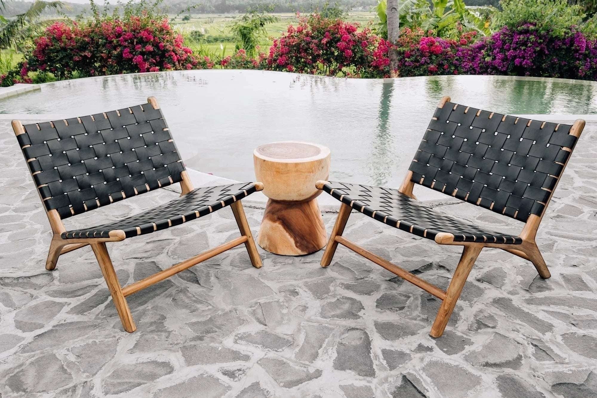 Kayu Living Umalas lounge chair with black handwoven leather seat and teak frame, modern design.