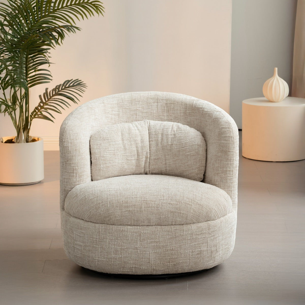Kayu Living Britt swivel armchair in cream textured fabric with a rounded back and plush seat cushion
