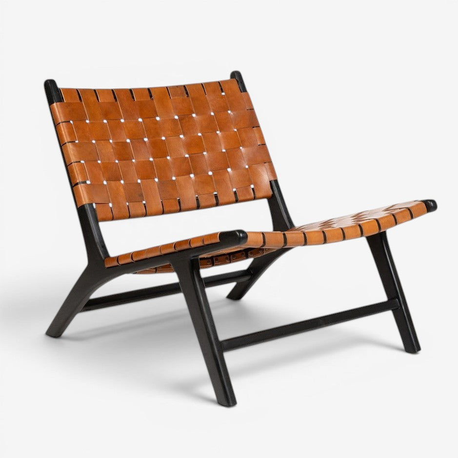 Kayu Living Philippa lounge chair with handwoven brown leather seat and black teak frame.