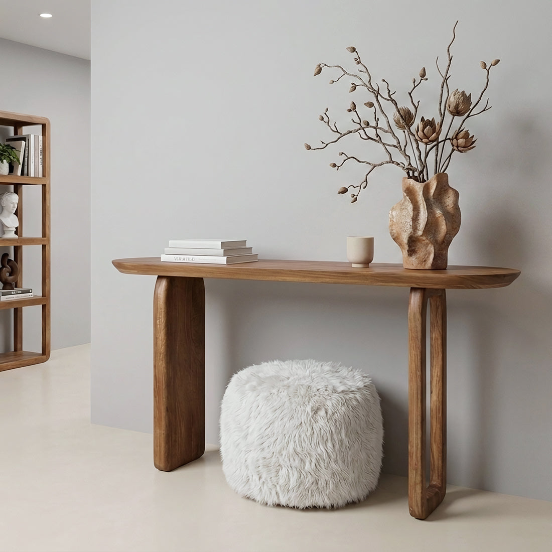 Kayu Living brown solid mango wood console table with rounded bullnose edges and legs in a minimalist living room.