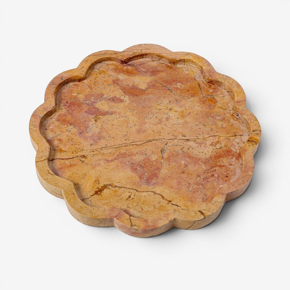Kayu Living Petal Tray in caramel veined onyx stone with pink, ochre, and terracotta hues. Features a wavy edge.