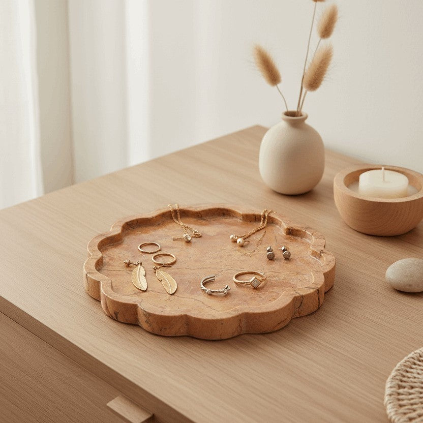 Kayu Living caramel veined onyx petal tray with wavy edges, holding jewelry. Decorative and functional.