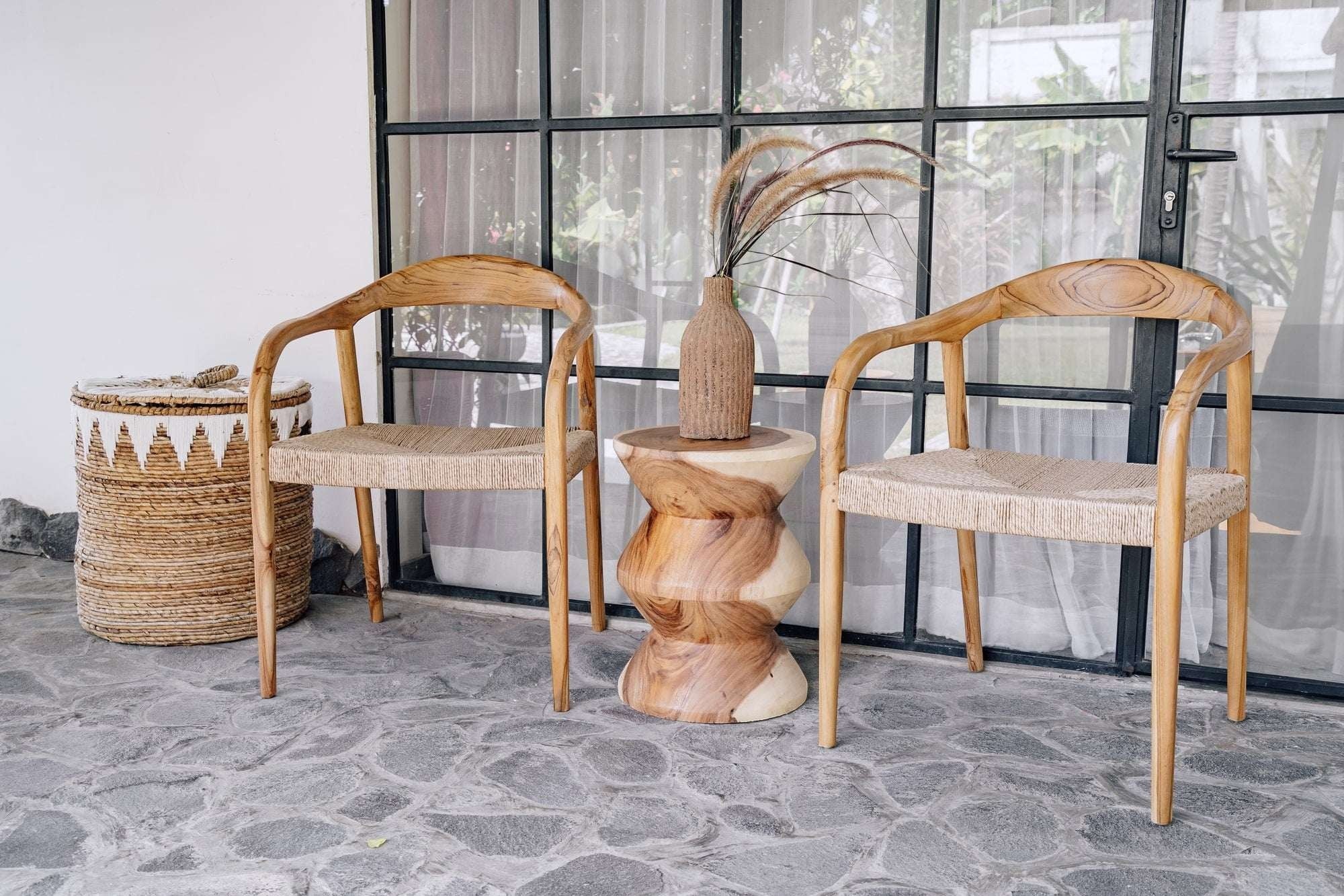 Kayu Living Cemagi chair with teak frame and handwoven rope seat, suitable for indoor/outdoor use.