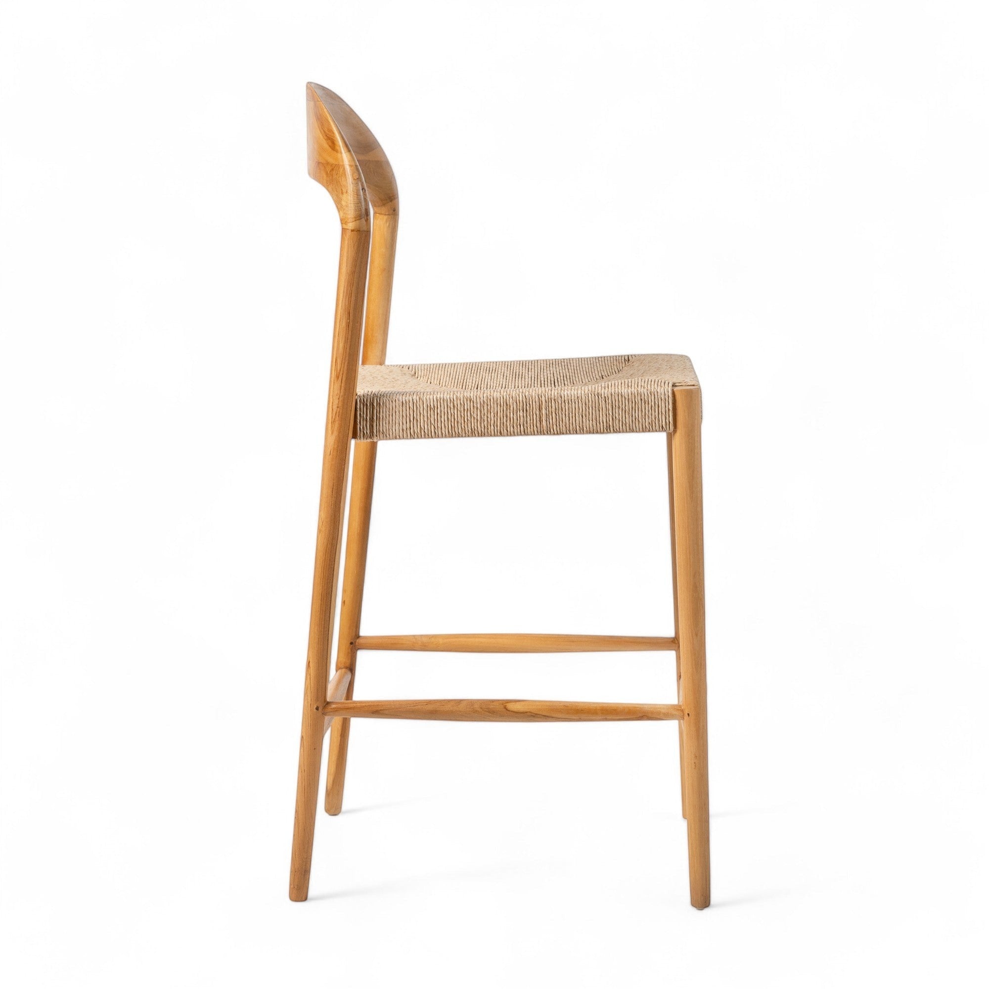 Kayu Living Cemagi teak and natural rope counter stool with curved back and footrest.
