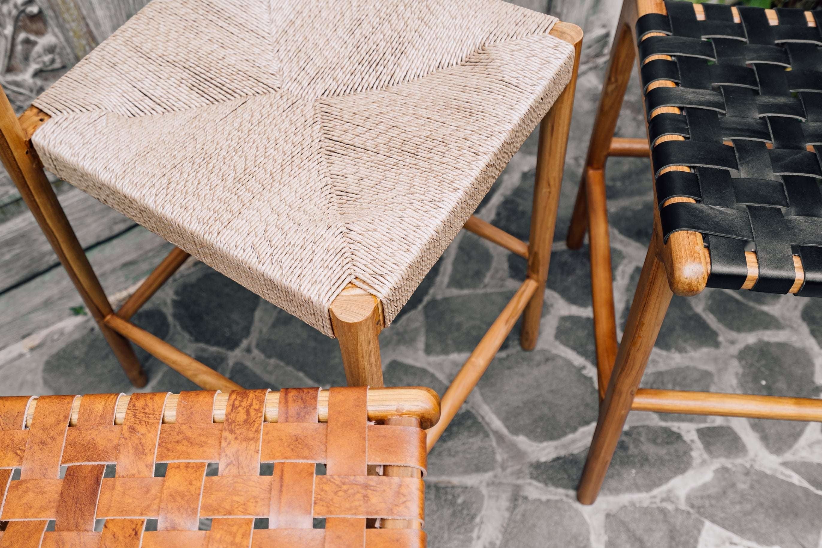 Kayu Living Cemagi teak counter stool with woven natural rope seat and wooden frame.