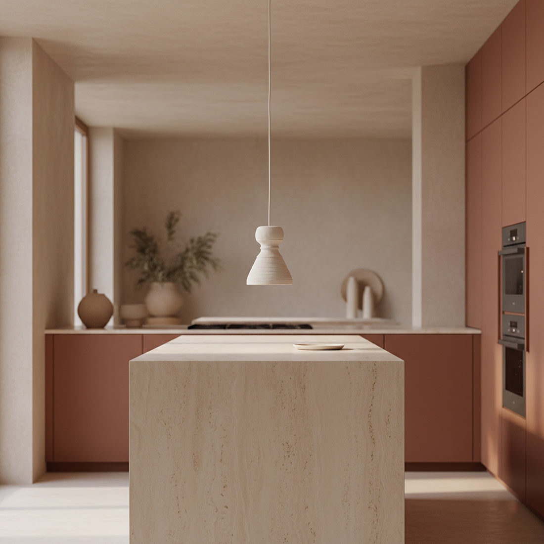 Kayu Living Kanoi pendant lamp with a matte chalky finish hanging above a stone kitchen island in a Japandi interior