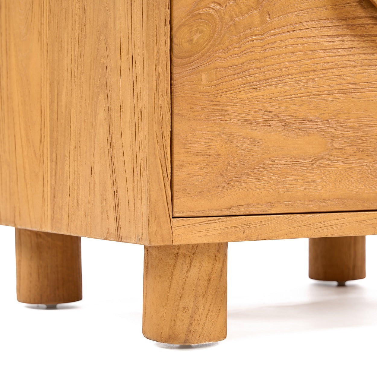 Kayu Living Eclipse nightstand in solid teak wood with natural grain and sturdy cylindrical legs.