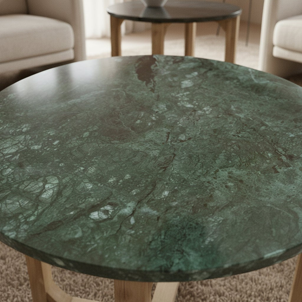 Kayu Living round side table featuring a deep green marble top with unique veining and a warm mango wood base.