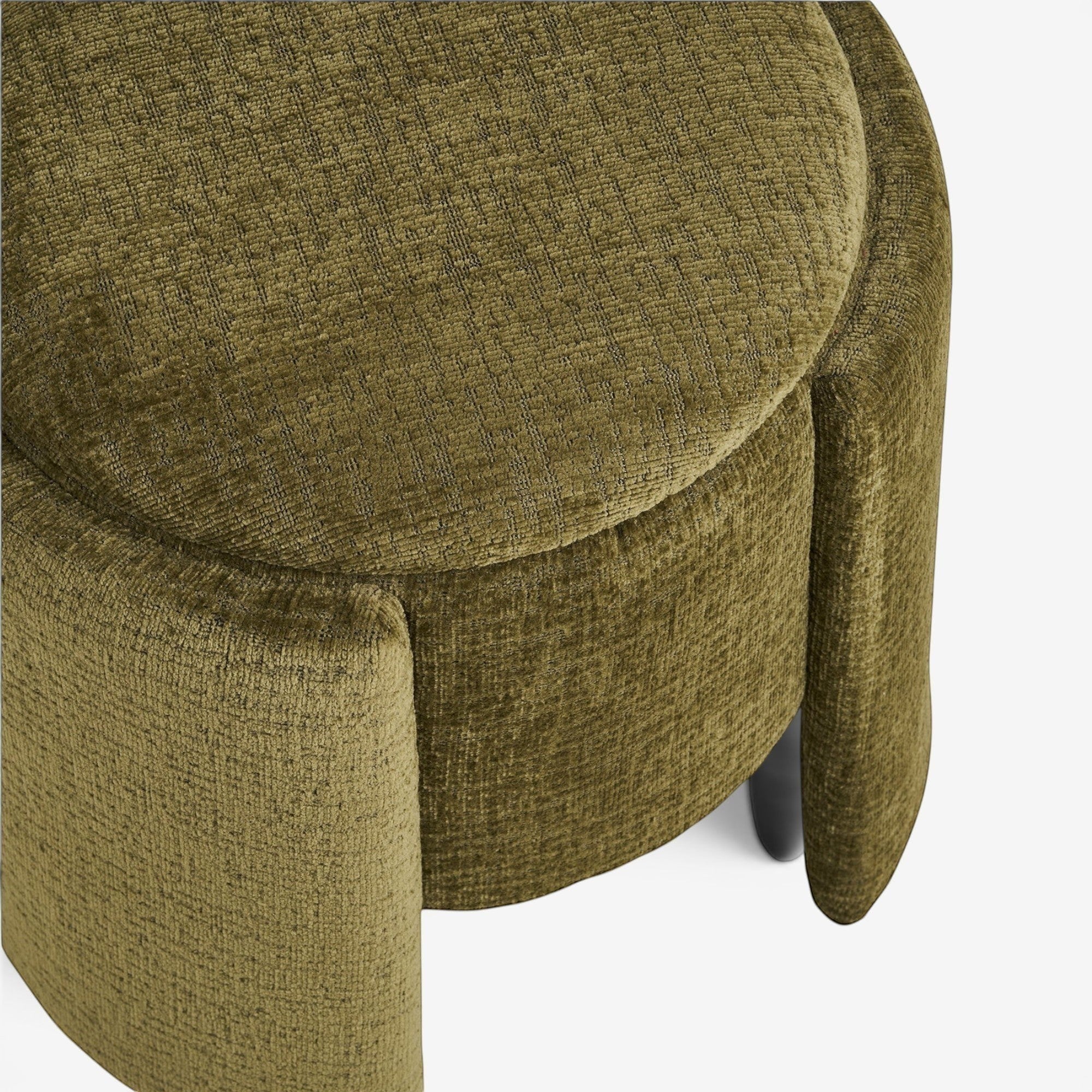 Kayu Living green round pouf upholstered in textured fabric with a plywood frame and high-density foam.
