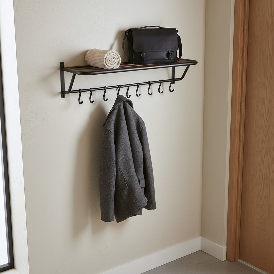 Kayu Living wall-mounted industrial coat rack with recycled wood shelf, black metal frame, and eight storage hooks.
