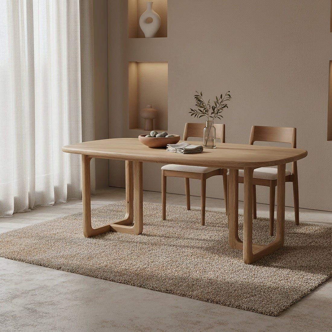 Kayu Living Invierno rectangular dining table in recycled teak with rounded corners and organic base on a beige rug.
