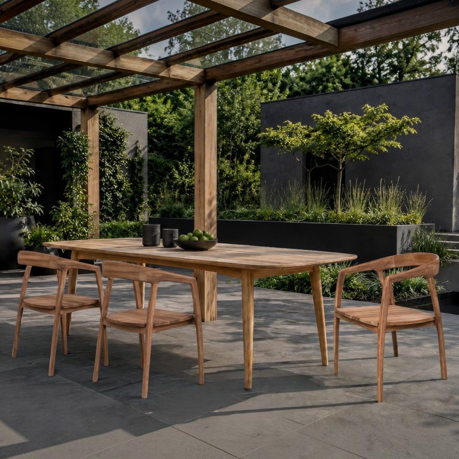 Kayu Living Lenzo dining chairs made of warm teak wood with organic curved backrests on a modern outdoor patio.
