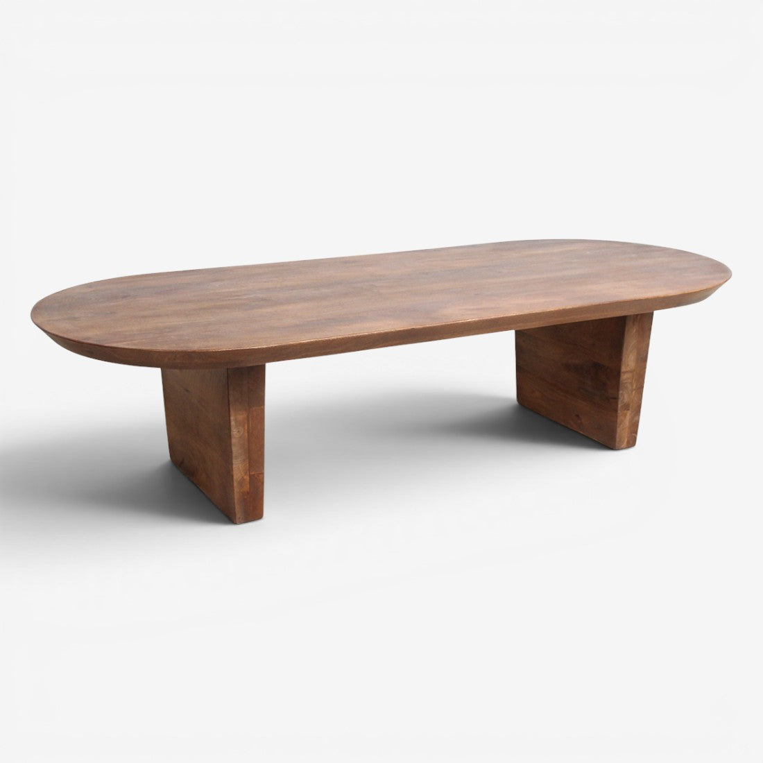 Kayu Living brown reclaimed mango wood coffee table with a smooth bullnose edge and sturdy pedestal base.