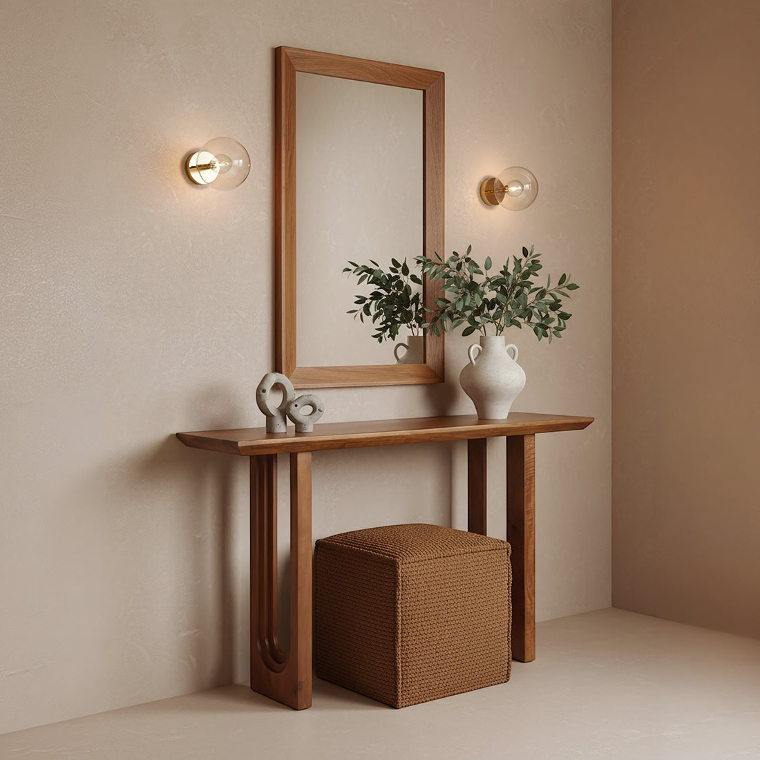 Kayu Living solid mango wood console table with chamfered edges, styled in a hallway with a mirror and brown ottoman.