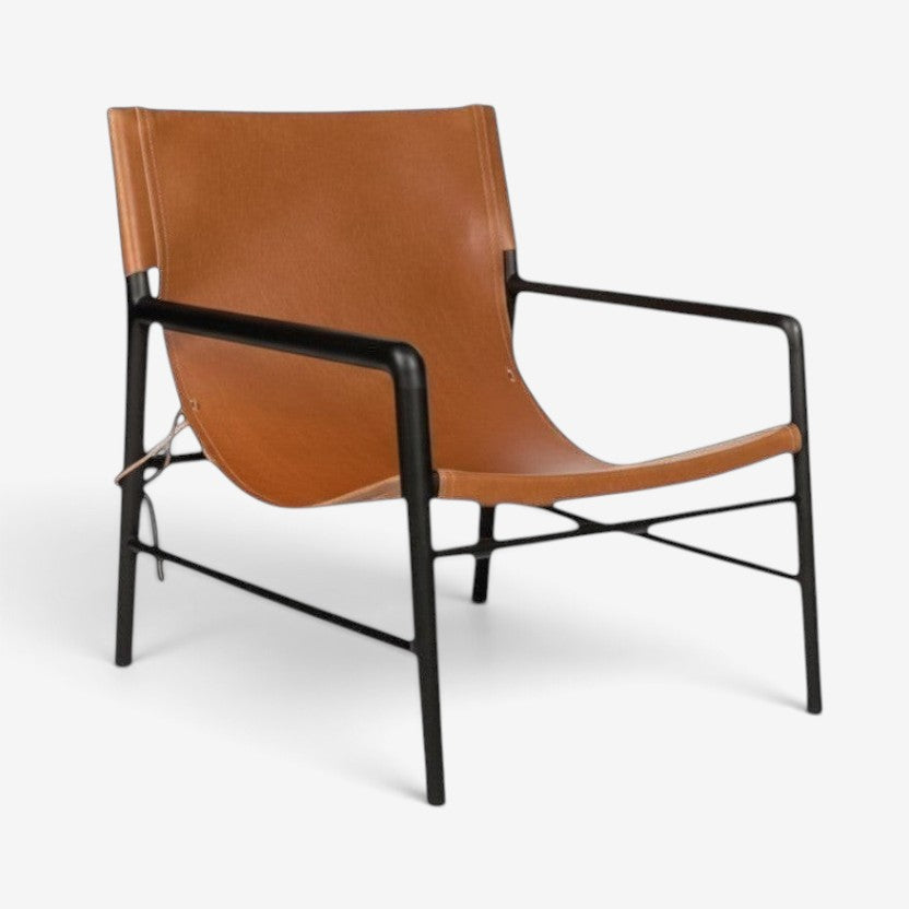 Kayu Living Marita lounge chair in cognac leather with a dark brown teak frame.