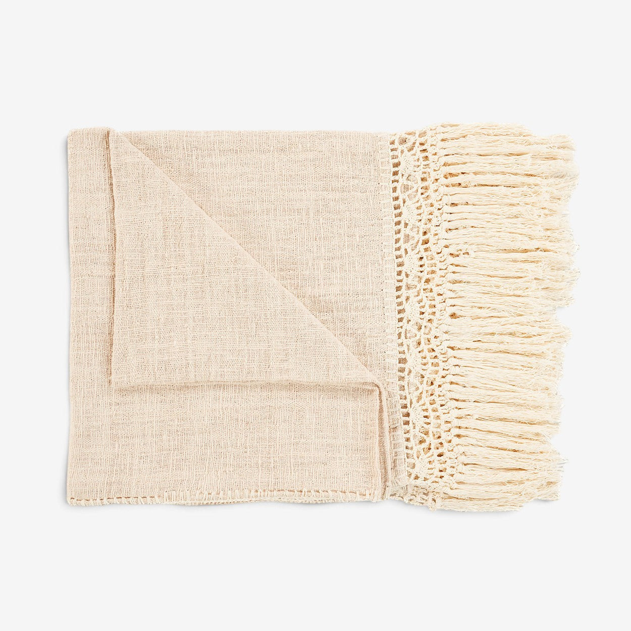 Kayu Living Gypsy bed throw in natural cotton with intricate crochet border and long fringe detail.