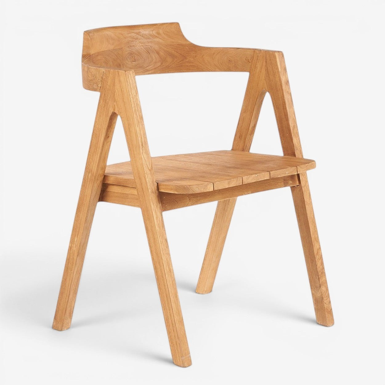 Kayu Living Nihi Sumba outdoor dining chair in natural teak with sculpted curves and crisp lines.