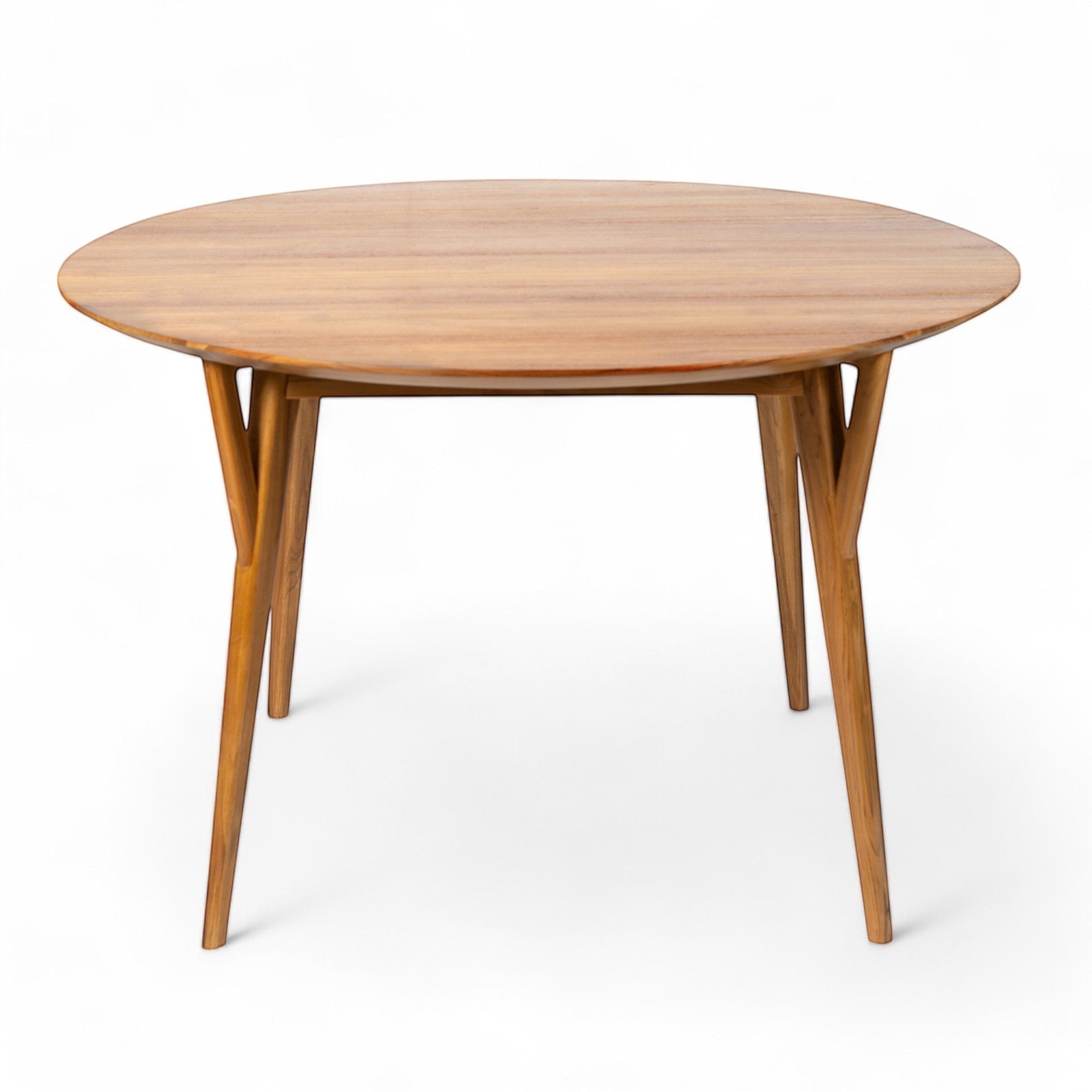 Kayu Living Pantai round teak dining table, 120 cm, with distinctive grain patterns and warm earthy tones.