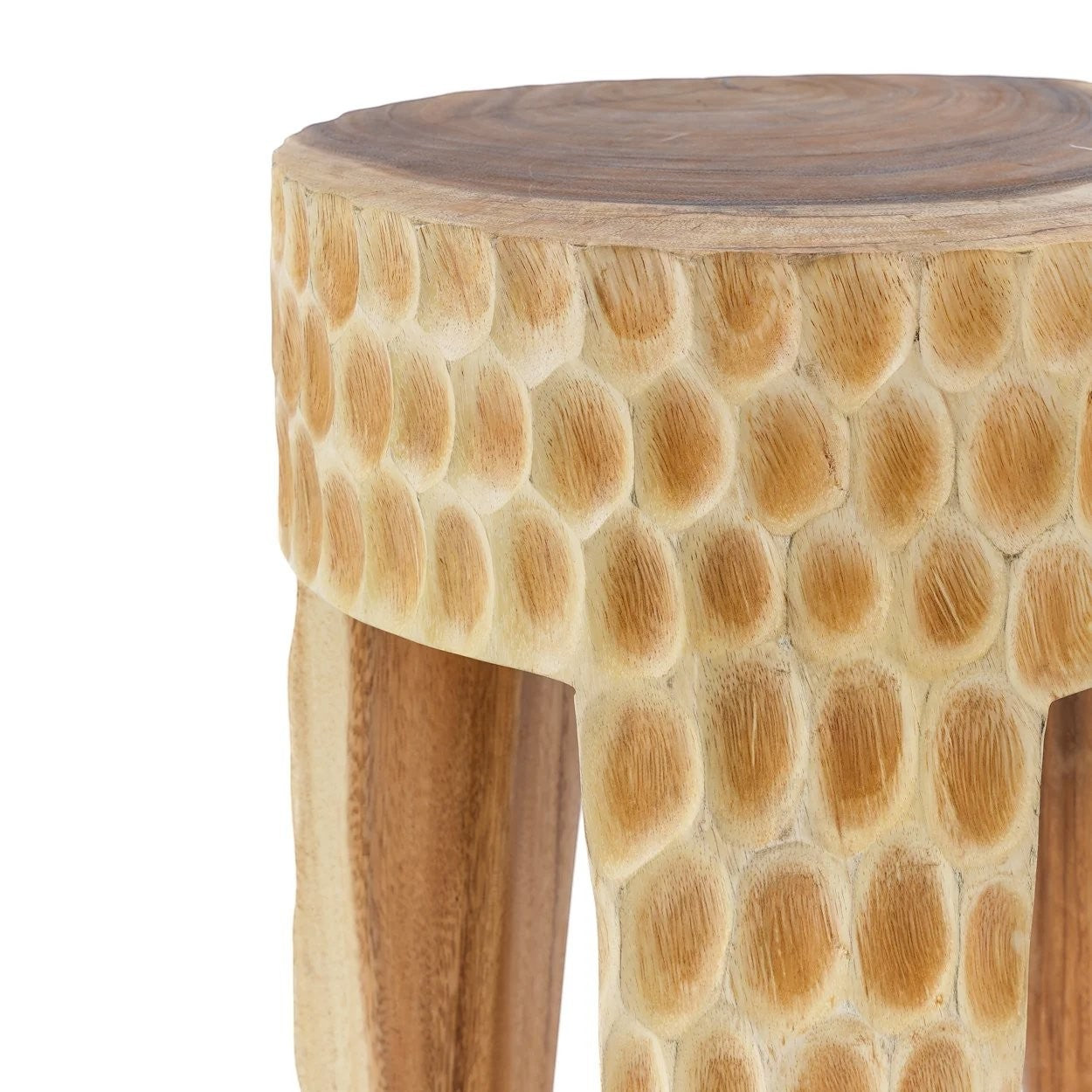 Kayu Living Paramo stool made of natural suar wood with a hand-carved honeycomb texture and three sturdy legs.
