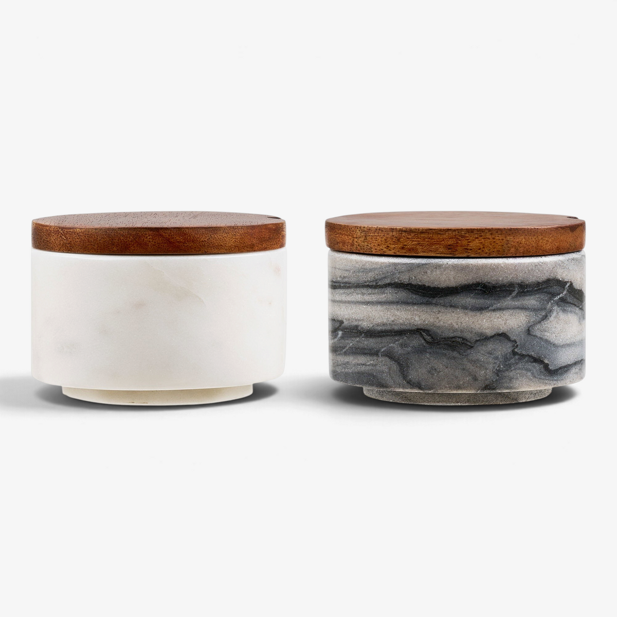 Kayu Living Pauri set of two marble storage jars with wooden lids in grey and white, featuring brass accents.