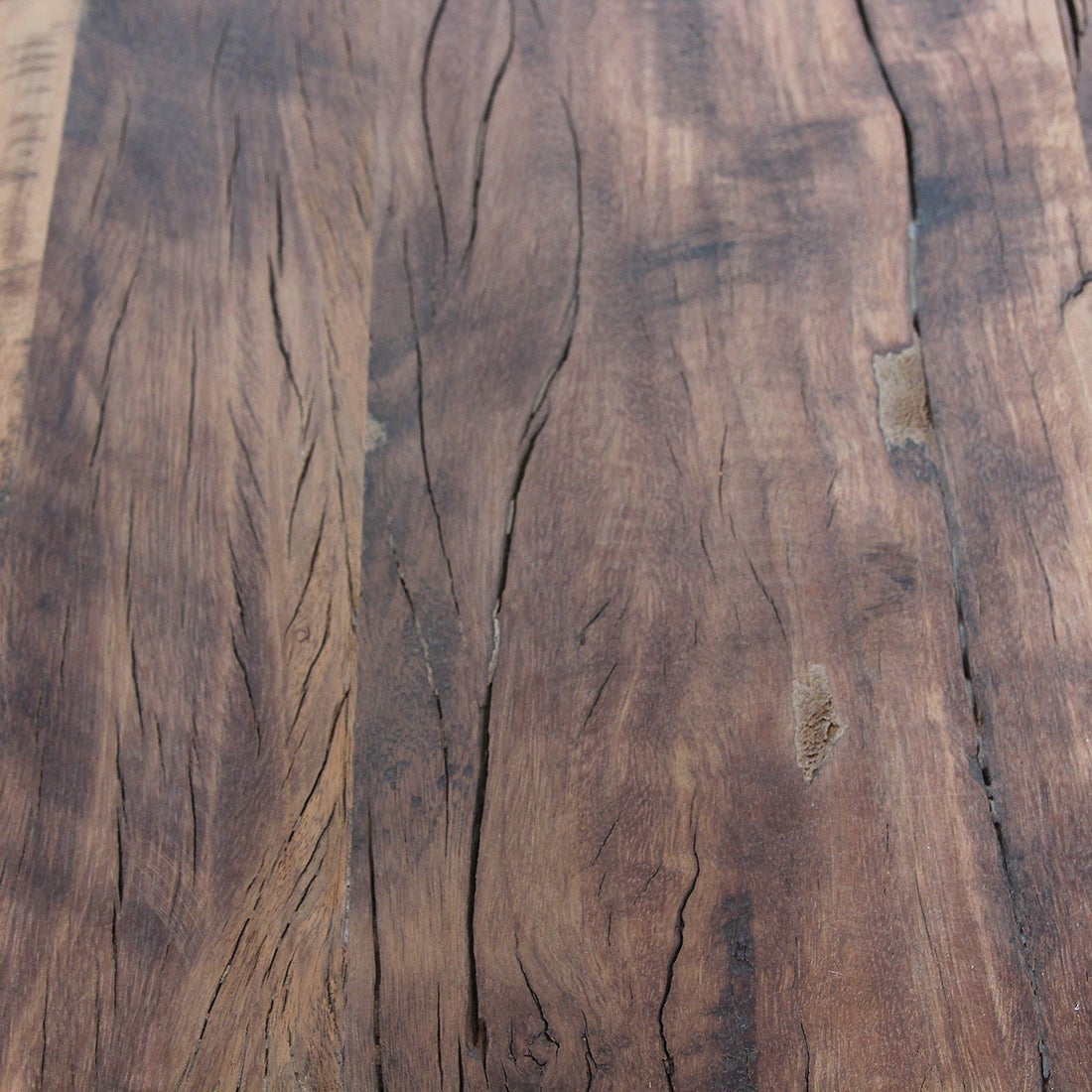 Kayu Living Farmwood wall table surface showing natural knots, deep wood grain, and rustic FSC recycled timber texture.