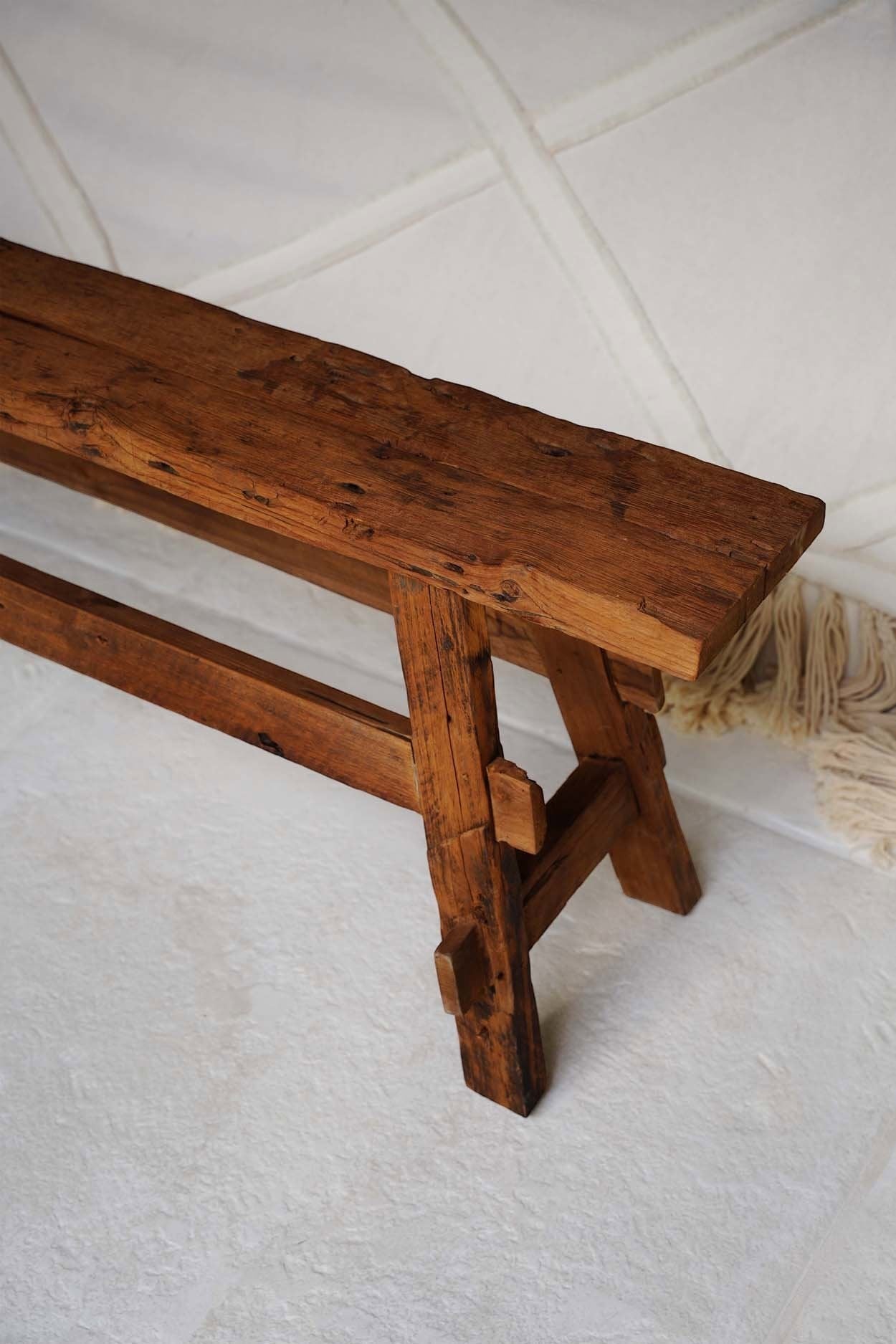 Kayu Living rustic bench handcrafted from solid Indonesian teak with a natural finish and visible wood grain.