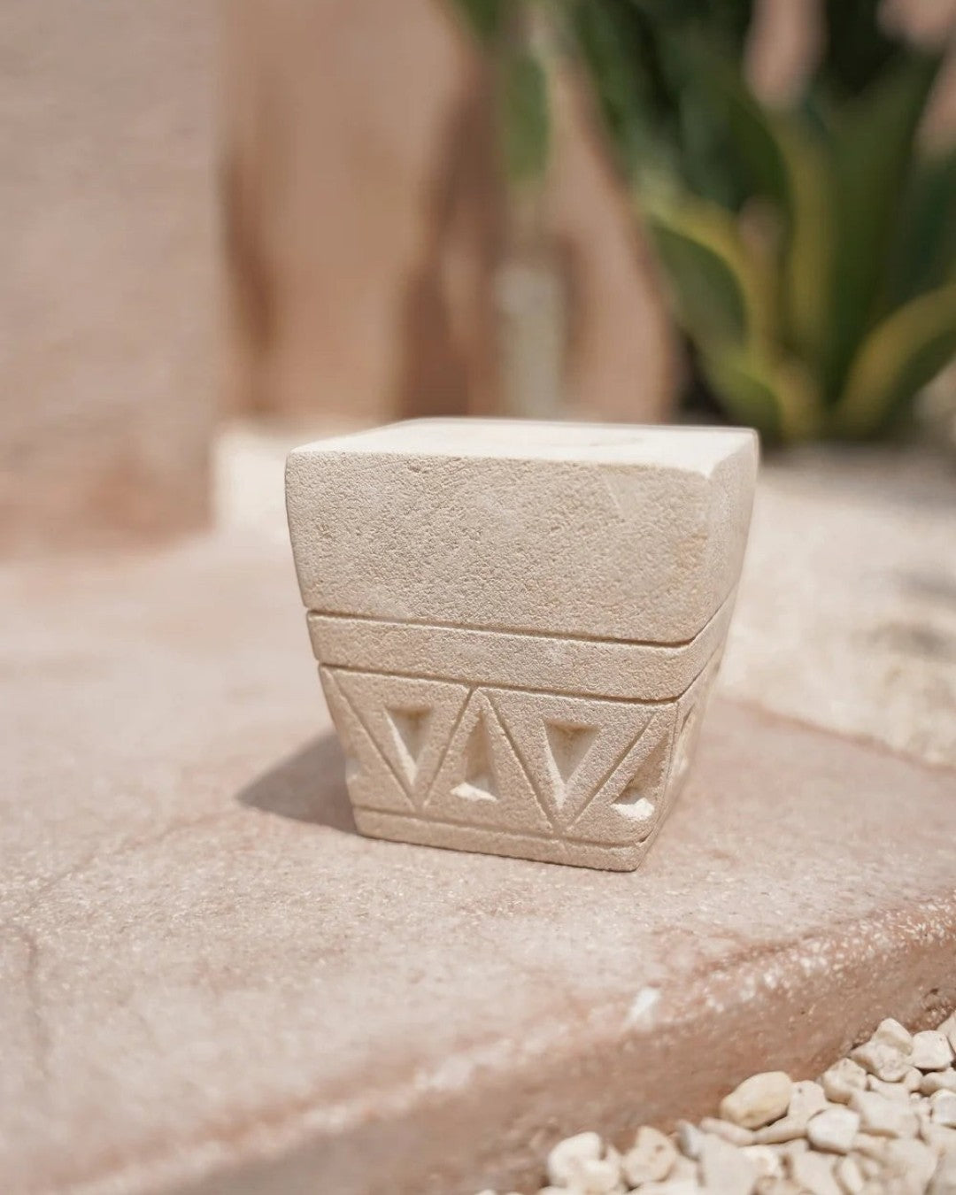 Kayu Living handmade stone candle holder with geometric engravings and a natural finish for tealight candles