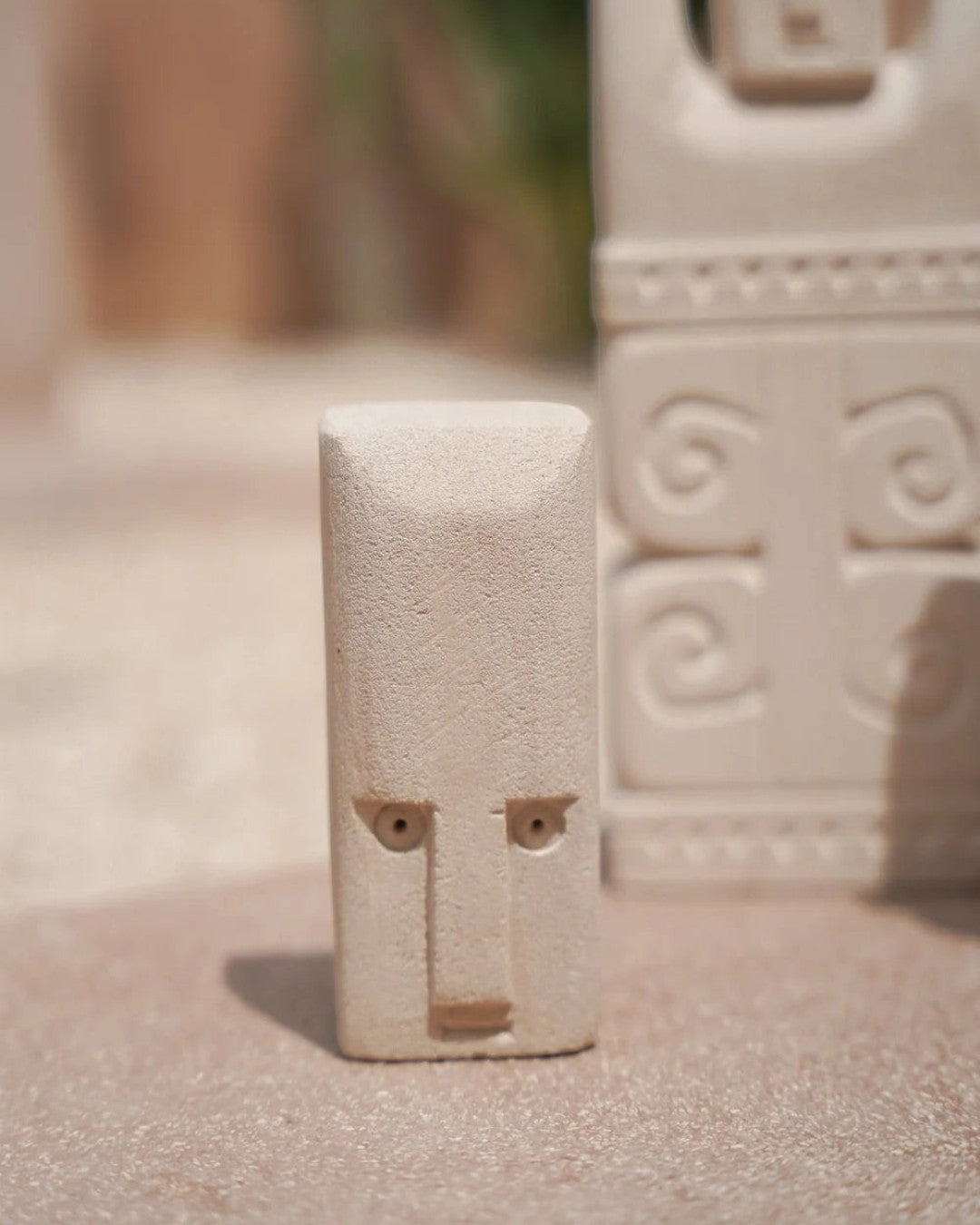 Kayu Living handcrafted Balinese stone figurine with a natural finish, featuring a minimalist face design.