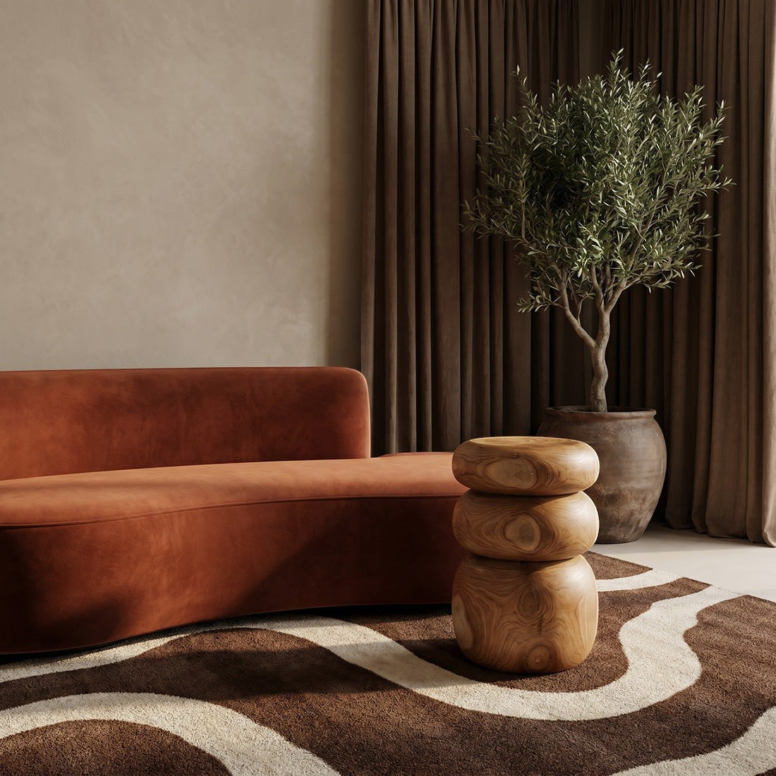 Kayu Living Tao teak side table with rounded, stone-like stacked design in a warm living room setting.