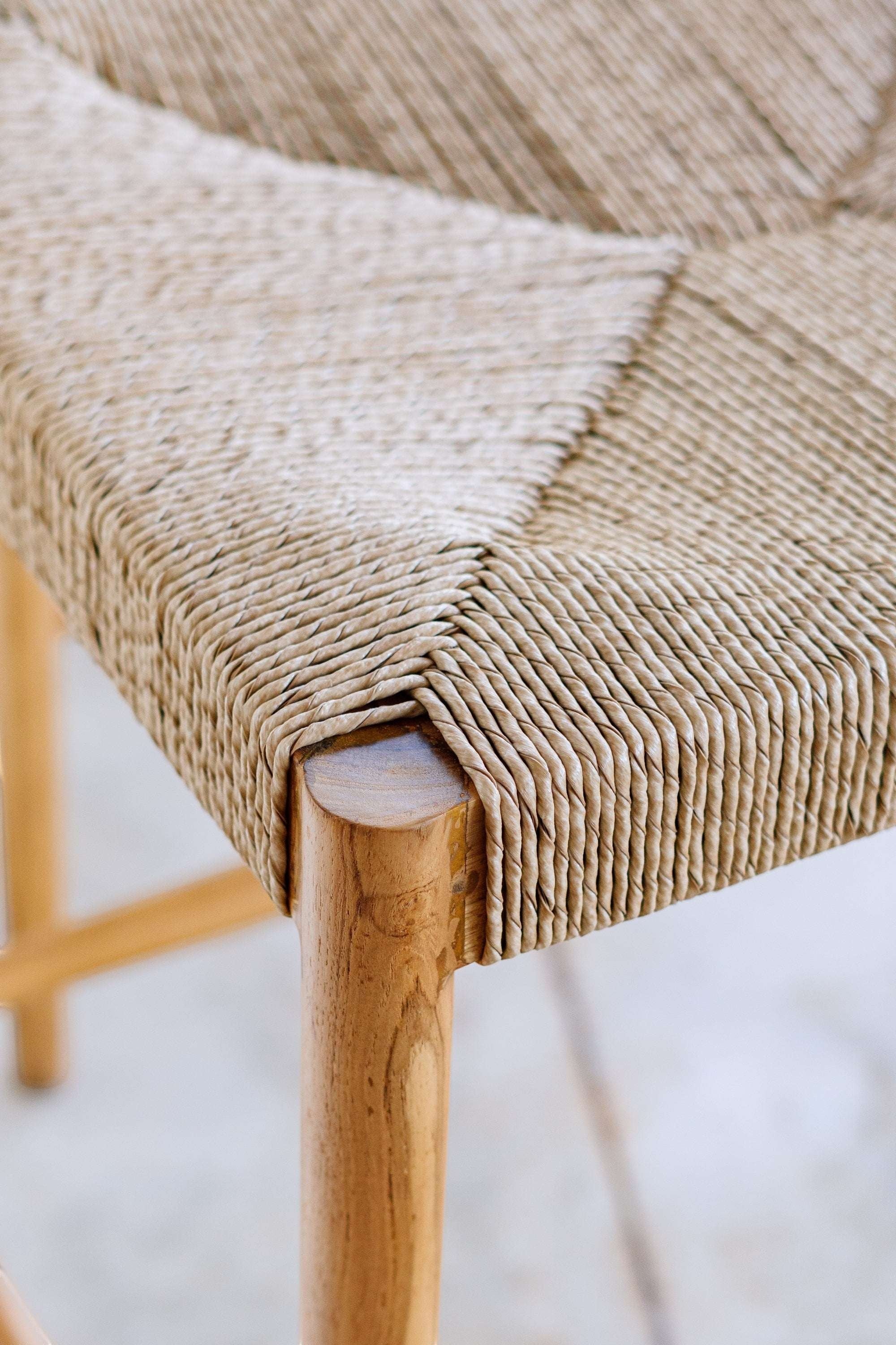 Kayu Living Cemagi counter stool with natural woven rope seat and teak frame, suitable for indoor/outdoor use.