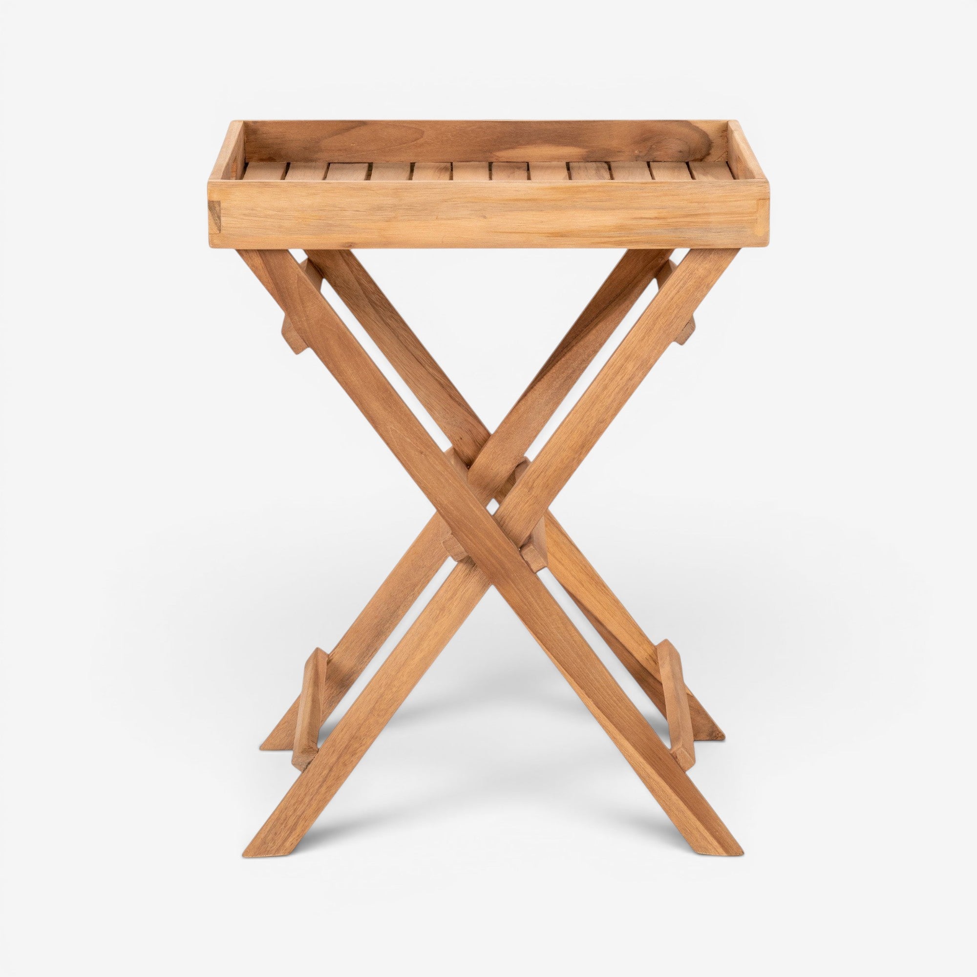 Kayu Living natural teak tray table with warm finish, foldable X-frame legs, versatile side table.