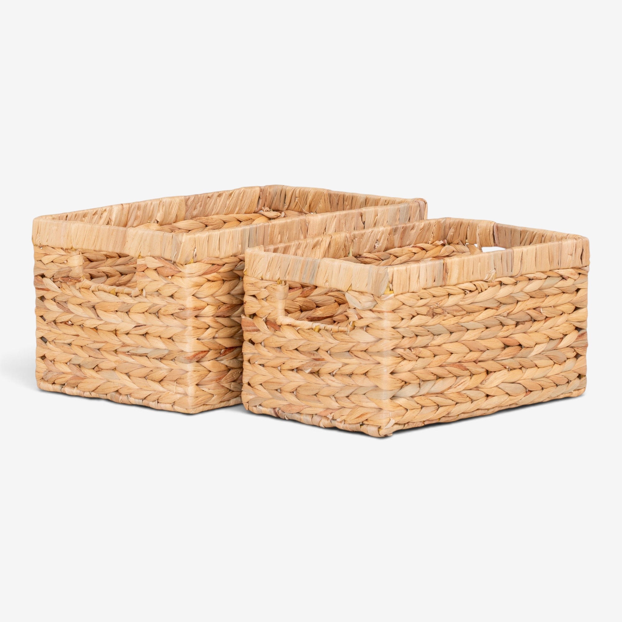 Kayu Living set of two handcrafted natural water hyacinth rectangular storage baskets with integrated handles.